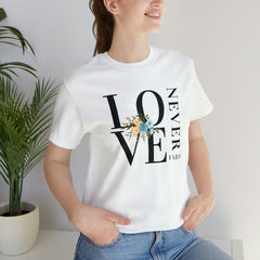 Love Never Fails White Unisex Jersey Short Sleeve Tee